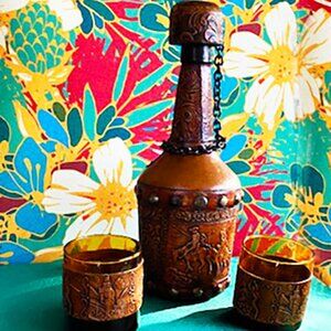 Leather embossed wine carafe w/2 matching glasses featuring legend Don Quixote